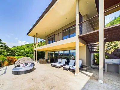 an exterior view of a house with a patio at Dos Rios #70- 6 Bedroom Home On 12 Acre in Brasilito