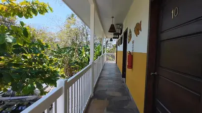 a hallway of a house with a door at Cabinas El Colibri, Apart Hotel in Carrillo