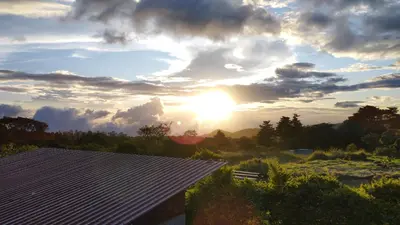 a view of the sunset from a house at Siary Aparment 2 in Monteverde Costa Rica