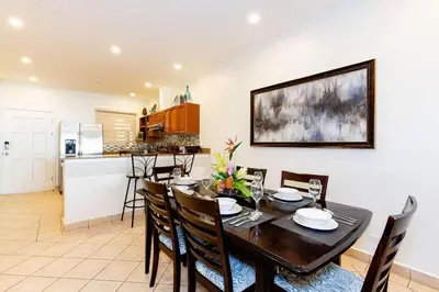 a kitchen and dining room with a table and chairs at Sunrise 27- 2 Bedroom Ocean View Condo in Tamarindo