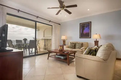 a living room with a couch and a table at Oceanica 824 in Playa Flamingo