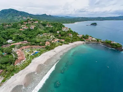 an aerial view of a beach and the ocean at Oceanica 824 in Playa Flamingo