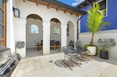 an outdoor patio with two chairs and a table at Paseo Miraflores 8 At Las Catalinas in Tempate