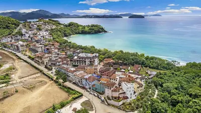 an aerial view of a town next to the ocean at Paseo Miraflores 7 At Las Catalinas in Tempate