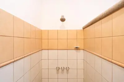 a bathroom with a shower with a light on the ceiling at Sunrise 12- 2 Bedroom Penthouse in Tamarindo