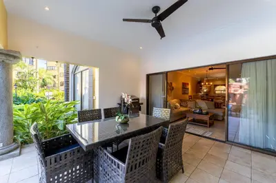 a dining room with a table and chairs at Sunrise 1- 3 Bedroom Poolside Condo in Tamarindo