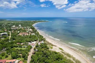 an aerial view of a beach and the ocean at Sunrise 48- 3 Bedroom Ocean View Penthouse Condo in Tamarindo