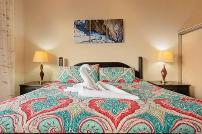 a woman laying on top of a bed at Sunrise 48- 3 Bedroom Ocean View Penthouse Condo in Tamarindo