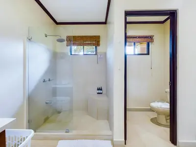 a bathroom with a shower and a toilet at Catalina Cove 3- 6 Bedroomloft Home in Brasilito