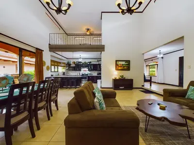 a living room with a couch and a table at Catalina Cove 3- 6 Bedroomloft Home in Brasilito