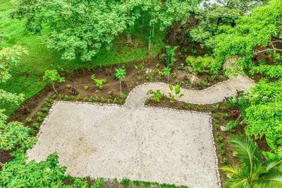 an overhead view of a garden with a large concrete floor at Pipa's Surf House Marbella Guanacaste in Cuajiniquil
