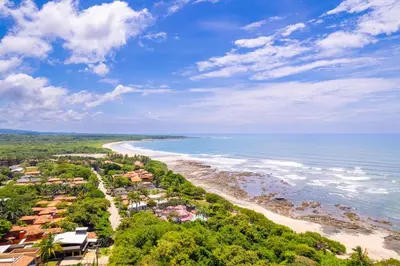 an aerial view of a beach with houses and the ocean at Villa Cerca Del Mar #6- 3Br House With Pool in Tamarindo