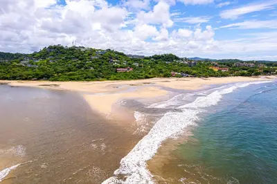 an aerial view of a beach with the ocean at El Diria 301- Ocean View 3 Bedroom Condo in Tamarindo
