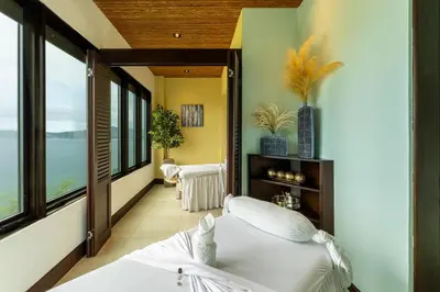 a bedroom with a bed and large windows at 360 Splendor 101A Ocean View Breakfast in Playa Flamingo