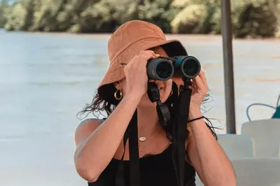 a woman in a hat taking a picture with a camera at 360 Splendor 101B Ocean View Studio With Breakfast in Playa Flamingo