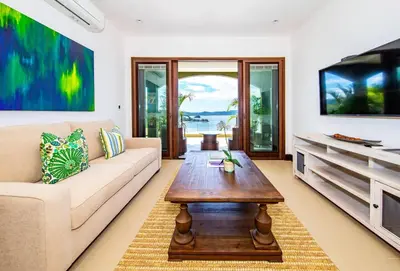 a living room with a couch and a coffee table at 360 Splendor 201-Ocean View Condo-Breakfast Included! in Playa Flamingo