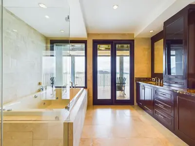 a large bathroom with a large tub and a window at 360 Splendor 310 Ocean View 3Br Breakfast in Playa Flamingo
