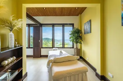 a hospital room with a bed and a window at 360 Splendor 101F Ocean View 2Br Breakfast in Playa Flamingo