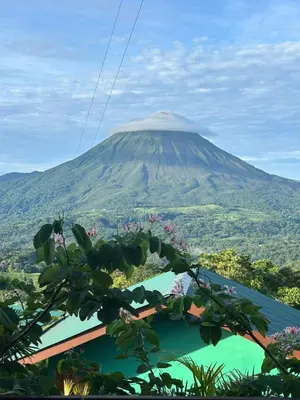 a view of a mountain with a tree at Encanto Arenal lodge in Fortuna