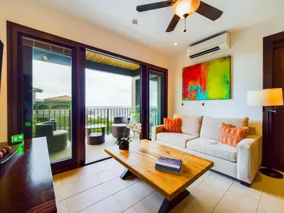 a living room with a couch and a table at 360 Splendor 405 Ocean View Condo- With Breakfast in Playa Flamingo