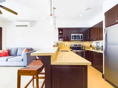 a kitchen with a sink and a counter top at 360 Splendor 307B-Ocean View Condo-Breakfast in Playa Flamingo