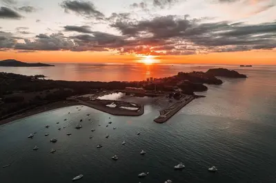an aerial view of a harbor with boats in the water at Palms 14 Luxury Beachfront Villa in Playa Flamingo