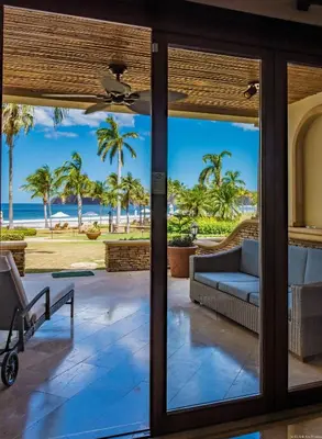 a view of the beach from the front door of a house at Palms 5 Luxury Beachfront Villa in Playa Flamingo