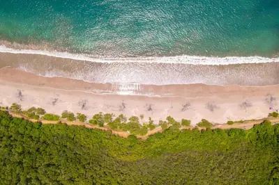 an overhead view of the beach and the ocean at Palms 5 Luxury Beachfront Villa in Playa Flamingo