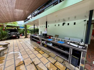 an outdoor kitchen with a counter in a garage at Brisa Del Mar in Playa Hermosa