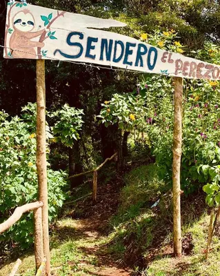 a sign for a garden with a sign for seanderroeper at Poas Volcano Observatory Lodge & Glamping in Poasito