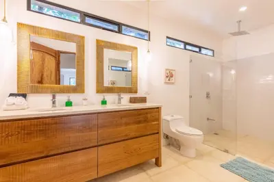 a bathroom with a sink and a toilet and a shower at Casa Vitality Bed and Breakfast - Playa Guiones, Nosara - 4 Minute Walk to the Beach in Nosara