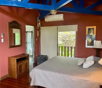 a bedroom with a bed and a window at Casa de veraneo Quinta Las Trillizas in Esparza