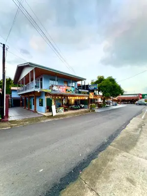 a building on the side of a street at Cabinas Las Palmas del Sol in Fortuna