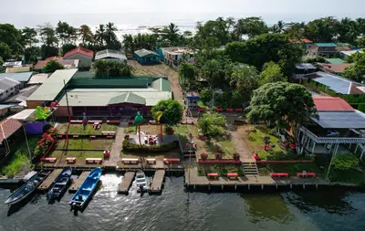 an aerial view of a town with boats in the water at Departamento 7 Tortuguero in Tortuguero