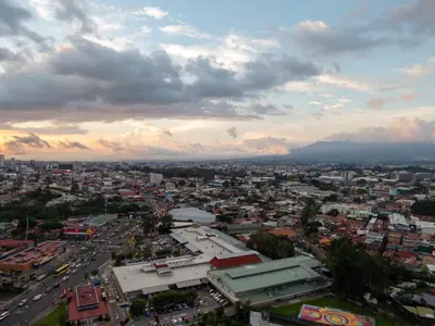 a view of a city with a cloudy sky at iFreses, Study Full equipped whith Pool, air- conditioning, spectacular view of the city, parking with additional payment in Curridabat