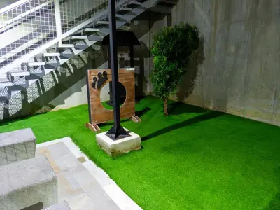 a balcony with green grass and a light pole at iFreses, Study Full equipped whith Pool, air- conditioning, spectacular view of the city, parking with additional payment in Curridabat