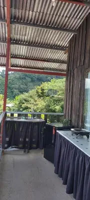 a room with a table with a table cloth on it at Hospedaje Coffee Mountain in San Isidro