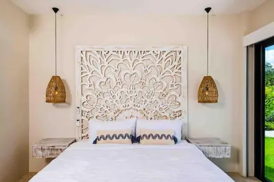 a bedroom with a large white bed with two pillows at Villa Twilight Tree 5Bdr Nature & Exclusivity in San José Pinilla