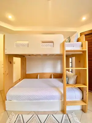 a couple of bunk beds in a room at Peninsula 46 - Upscale 2bdr with Jacuzzi - Beach - Fast wifi - Gym in Tamarindo