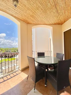 a dining room with a table and chairs on a balcony at Peninsula 46 - Upscale 2bdr with Jacuzzi - Beach - Fast wifi - Gym in Tamarindo