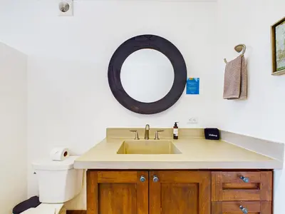 a bathroom with a sink and a toilet and a mirror at Calle Cartagena 14C At Catalinas in Playa Danta