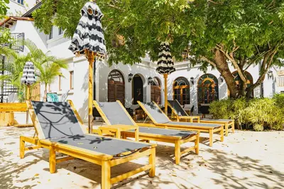 a row of lounge chairs in front of a building at Calle Cartagena 3C At Las Catalinas in Playa Danta