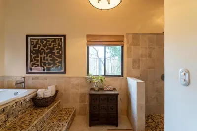 a bathroom with a tub and a sink at Casa Rosa- Luxury Ocean View 3 Bedroom Home in Brasilito