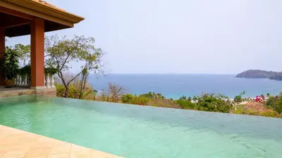 a swimming pool with a view of the ocean at Casa Rosa- Luxury Ocean View 3 Bedroom Home in Brasilito