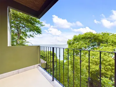 a balcony with a view of the ocean at 360 Splendor 307A-Ocean View 2 Br Condo-Breakfast in Playa Flamingo