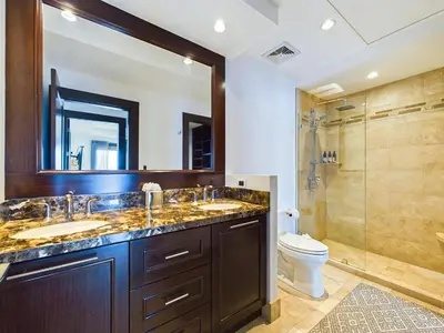 a bathroom with two sinks and a shower at 360 Splendor 307A-Ocean View 2 Br Condo-Breakfast in Playa Flamingo
