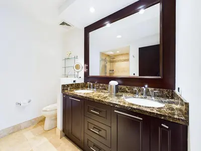 a bathroom with a sink and a mirror at 360 Splendor 404-Ocean View Condo- With Breakfast in Playa Flamingo