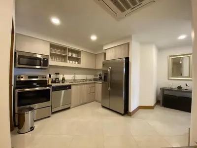 a kitchen with a stainless steel refrigerator and appliances at ✰Upscale 3Bdr condo✰ Incredible amenities ✰Fast wifi in Tamarindo