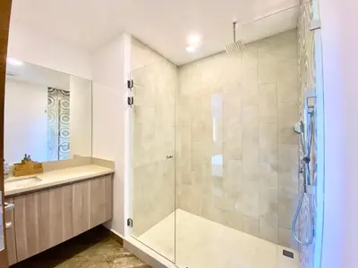 a bathroom with a shower and a sink at ✰Upscale 3Bdr condo✰ Incredible amenities ✰Fast wifi in Tamarindo