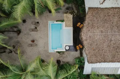 an overhead view of a pool in the middle of a yard at Casa Arena Beachfront Property in Santa Teresa Beach